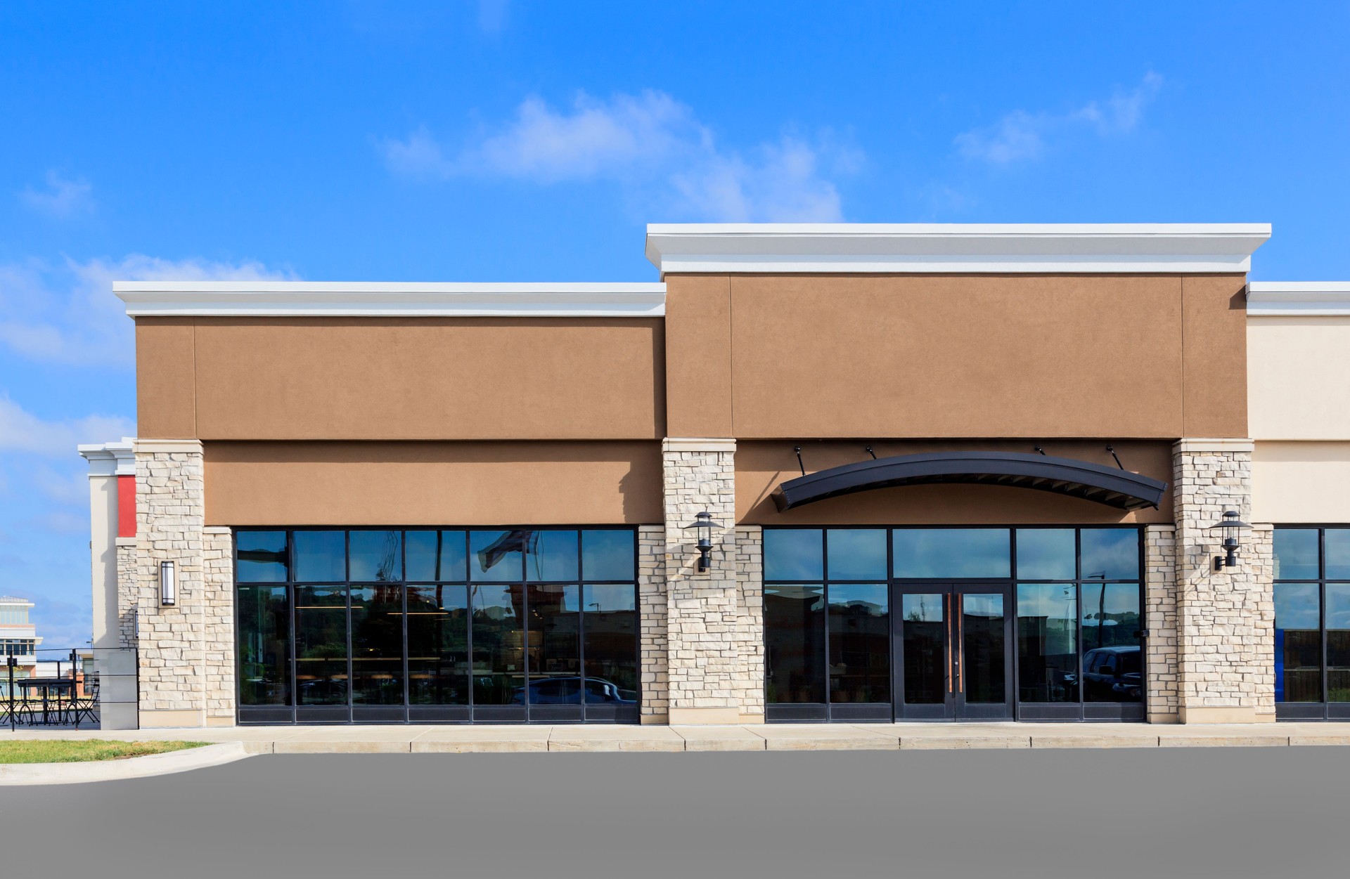 Pre-engineered commercial metal retail building with stone and stucco facade in Texas Pre-engineered commercial metal retail building with stone and stucco facade in Texas
